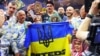 Украинский боксер Александр Усик празднует победу над британцем Тайсоном Фьюри, завоевав титул абсолютного чемпиона мира в сверхтяжелом весе. Эр-Рияд, Саудовская Аравия, 19 мая 2024 года