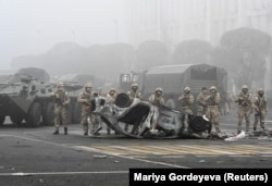 Troops are seen at the main square in Almaty where hundreds of people were protesting against the government in January 2022.