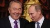 Russia - Russian President Vladimir Putin (R) speaks with Kazakhstan's President Nursultan Nazarbayev (L) during sign documents ceremony before opening of the Supreme Eurasian Economic Council in Moscow, 24 December 2013