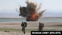IRAN - A handout photo made available by the Iranian Army office shows an explosion during a military exercise by the Iranian Army in the northwest of Iran, close to the border with Azerbaijan,1 October, 2021. 