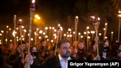 Armenia - A torchlight procession march during a demonstration to mark the 106th anniversary of the Armenian Genocide, in Yerevan, April 23, 2021.