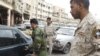 Disarmed members of the Sahwa anti-Qaeda militia man a checkpoint in Baghdad's Fadel district, 02Apr2009