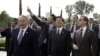 Kazakh President Nursultan Nazarbayev (left), Chinese President Hu Jintao (center), and Russian President Dmitry Medvedev stroll before the summit.