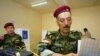 Kurdish peshmerga militia officers vote in Irbil. With a third of the seats, the opposition in the region has challenged the duopoly of the two ruling parties.