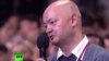 Журналист Владимир Маматов баспасөз мәслихатында Ресей президенті Владимир Путинге сұрақ қойып тұр. 18 желтоқсан 2014 жыл. 