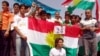 Iraqi Kurdish demonstrators in Irbil protest the passage of a bill delaying the census in the disputed region of Kirkuk.