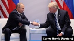 U.S. President Donald Trump (right) shakes hands with Russia's President Vladimir Putin in Hamburg, Germany, on July 7.