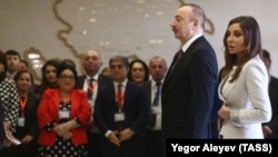 AZERBAIJAN -- Azerbaijani President Ilham Aliyev and his wife Mehriban arrive at a polling station in Baku, April 11, 2018