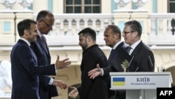 A file photo shows European leaders and Ukrainian President Volodymyr Zelenskyy shaking hands after a joint press conference in Kyiv on May 10, 2025.